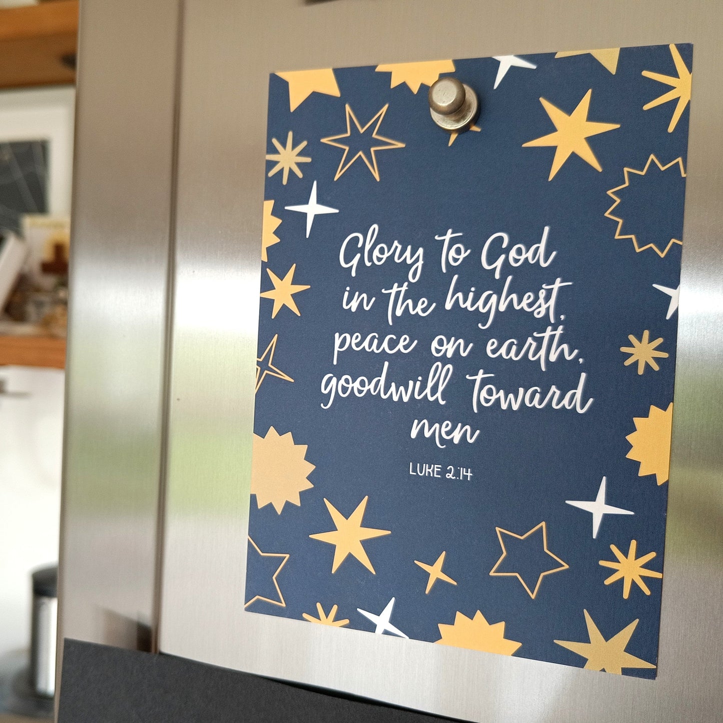 Decorative poster with star patterns and text on a refrigerator