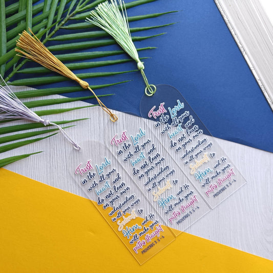 Clear bookmarks with colorful text on a blue and yellow background with leaves and tassels.