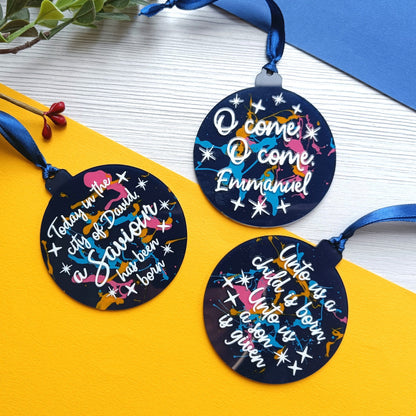 Three circular ornaments with festive text and designs on a yellow and white background.